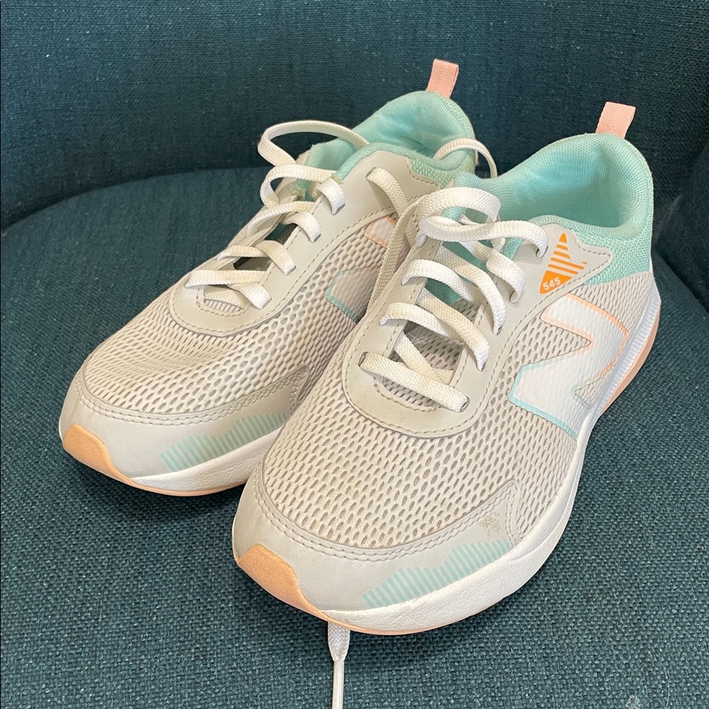New Balance light teal and gray sneakers